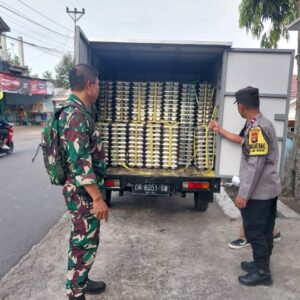 Bhabinkamtibmas Polsek Batukliang Utara Dampingi Pendistribusian Makan Bergizi Gratis di Desa Aik Bukaq